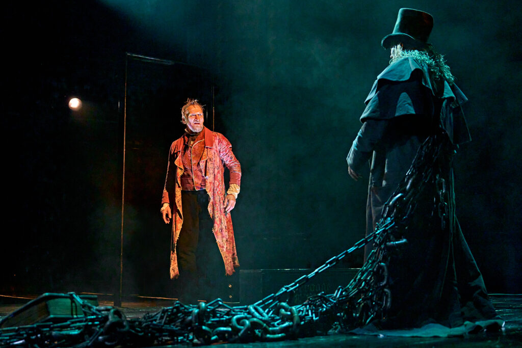 Christopher Eccleston as Scrooge faces the ghost of Marley